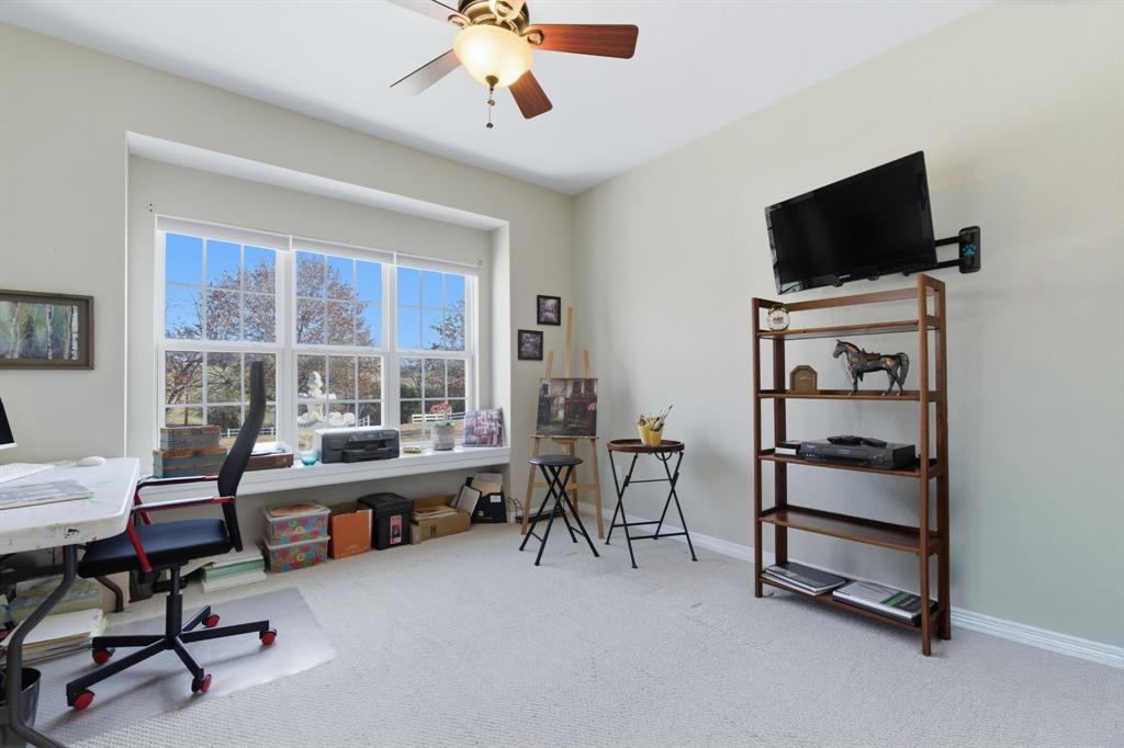 240 Johnson Bend Road Weatherford, TX 76088 - Photo 25 of 40 a view of a livingroom with workspace and a window