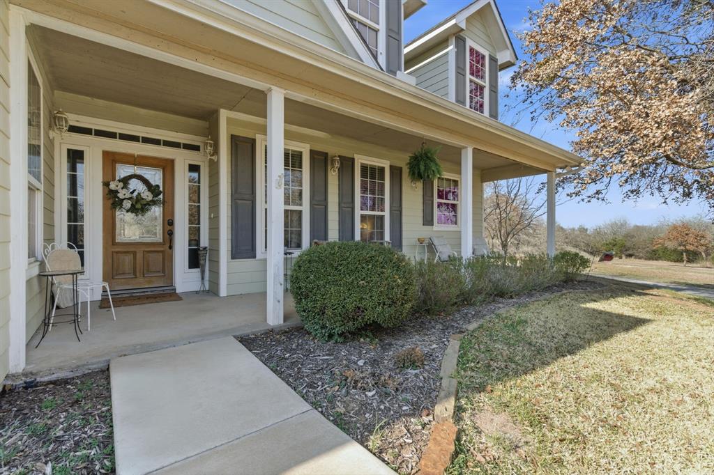 240 Johnson Bend Road Weatherford, TX 76088 - Photo 5 of 40 front view of a house with a yard