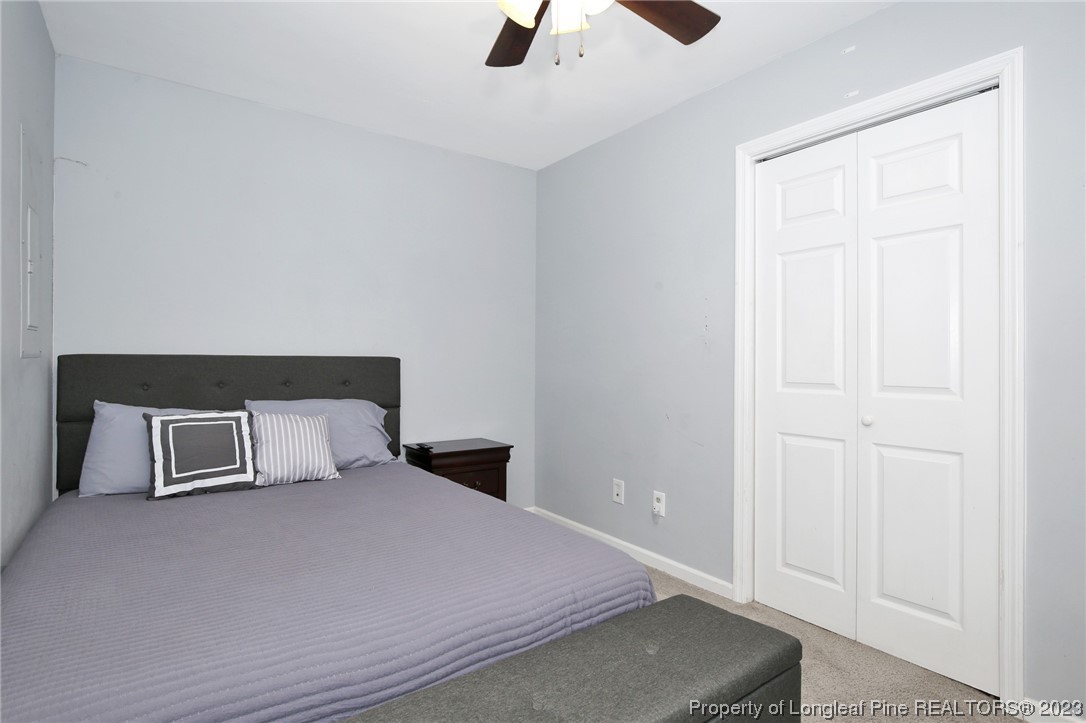 304 Kernstown Road Raeford, NC 28376 - Photo 18 of 33 a bedroom with a bed and painting on the wall