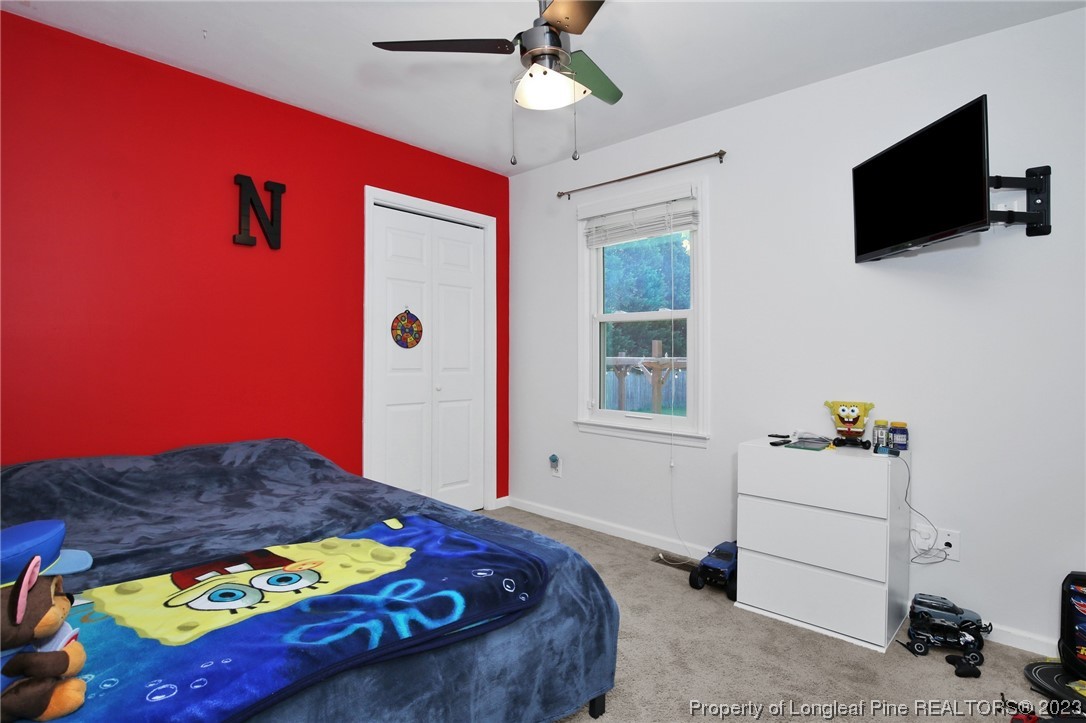 304 Kernstown Road Raeford, NC 28376 - Photo 19 of 33 a bedroom with a bed and a flat screen tv