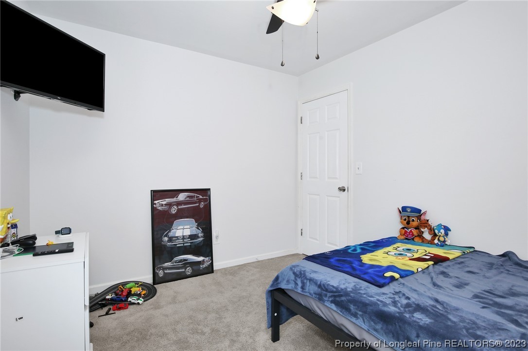 304 Kernstown Road Raeford, NC 28376 - Photo 20 of 33 a bedroom with a bed and a flat screen tv