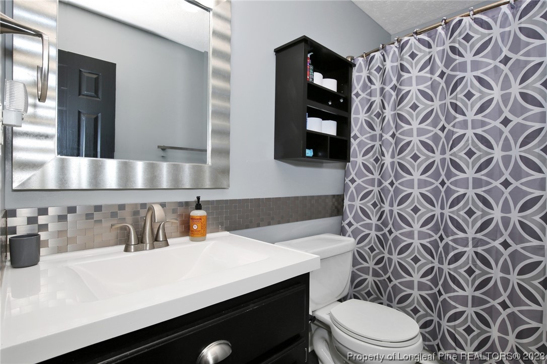 304 Kernstown Road Raeford, NC 28376 - Photo 21 of 33 a bathroom with a sink and a mirror