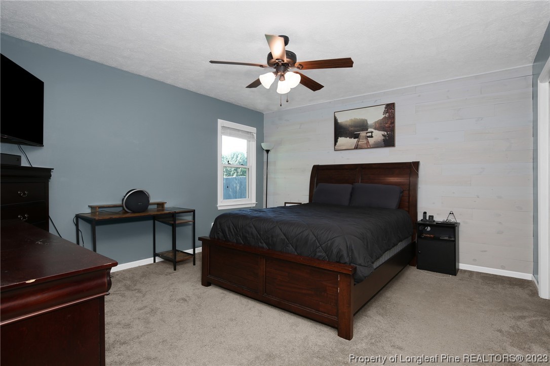 304 Kernstown Road Raeford, NC 28376 - Photo 22 of 33 a bedroom with a bed and a flat screen tv