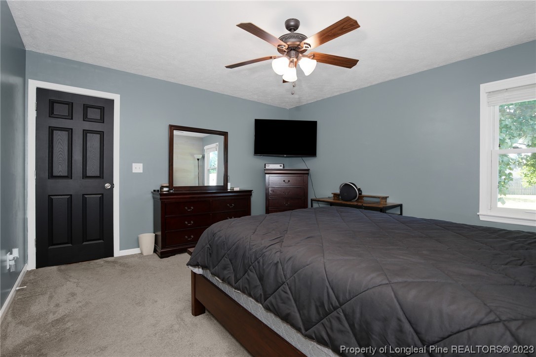 304 Kernstown Road Raeford, NC 28376 - Photo 23 of 33 a bedroom with a large bed and a tv