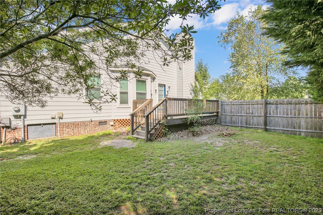 304 Kernstown Road Raeford, NC 28376 - Photo 28 of 33 a view of backyard with wooden fence and a large tree