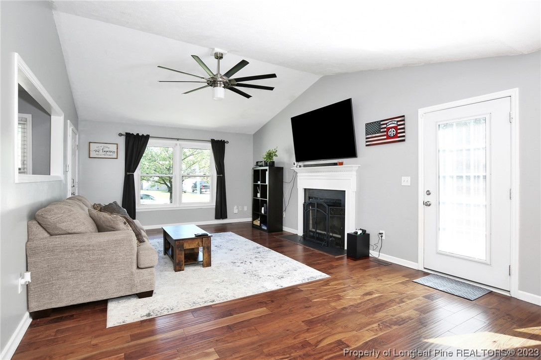 304 Kernstown Road Raeford, NC 28376 - Photo 5 of 33 a living room with fireplace furniture and a flat screen tv