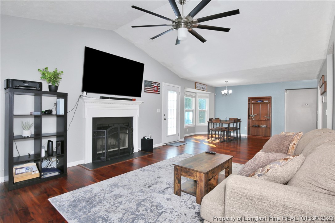 304 Kernstown Road Raeford, NC 28376 - Photo 8 of 33 a living room with furniture a flat screen tv and a fireplace
