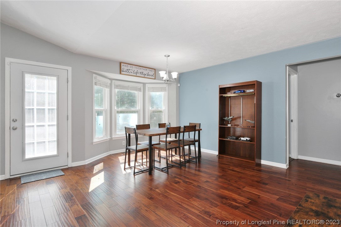 304 Kernstown Road Raeford, NC 28376 - Photo 9 of 33 a view of a dining room with furniture window and wooden floor