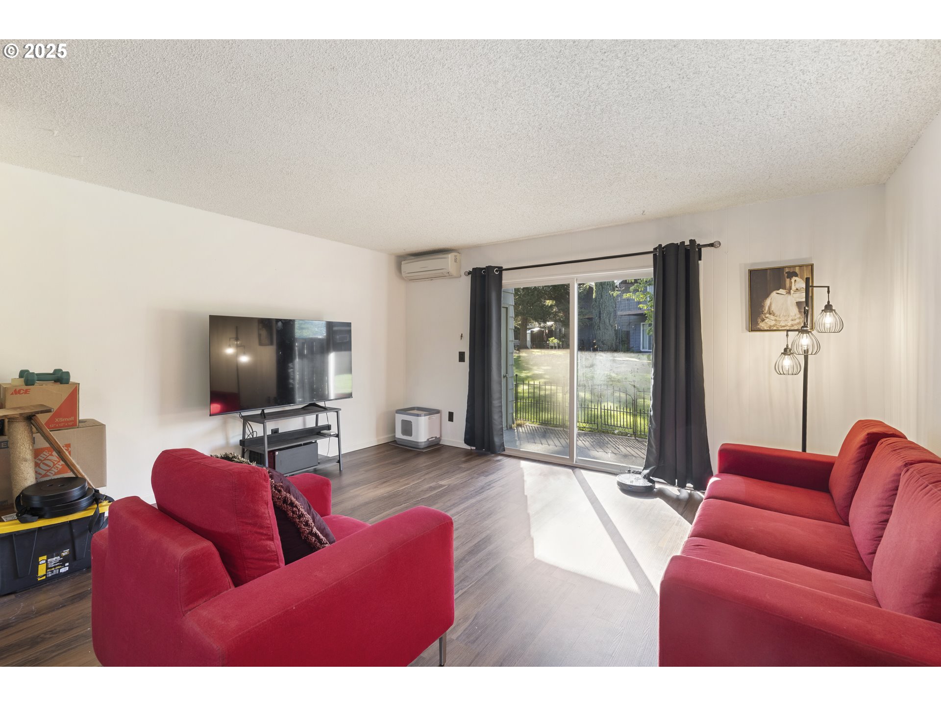 1418 Northeast Hogan Drive Gresham, OR 97030 - Photo 12 of 43 a living room with furniture and a flat screen tv