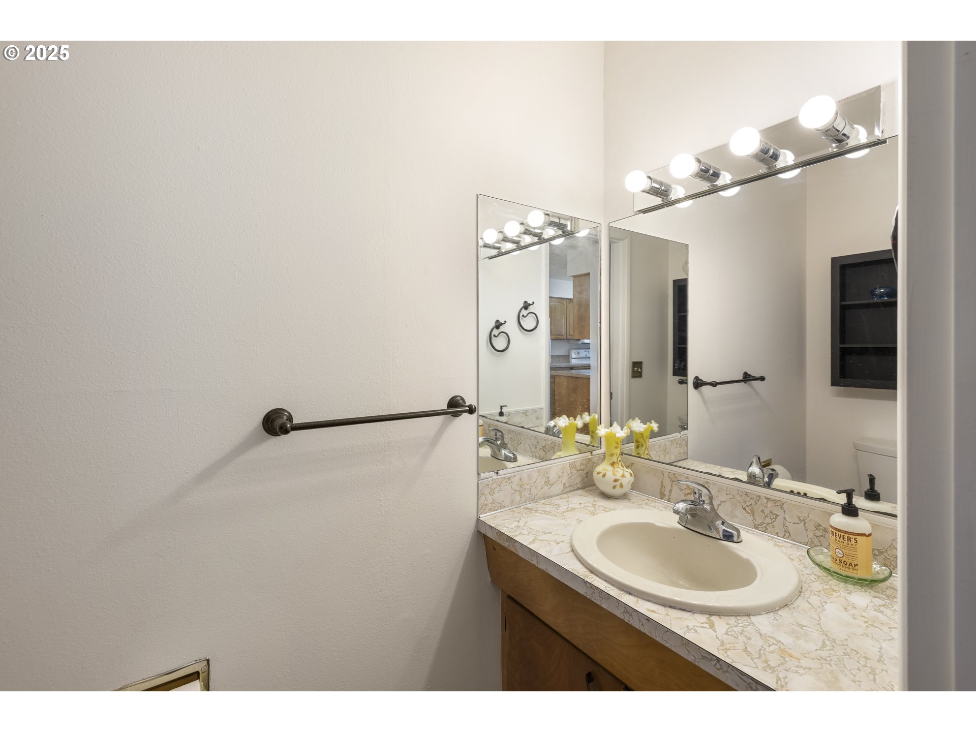 1418 Northeast Hogan Drive Gresham, OR 97030 - Photo 17 of 43 a bathroom with a sink and a mirror