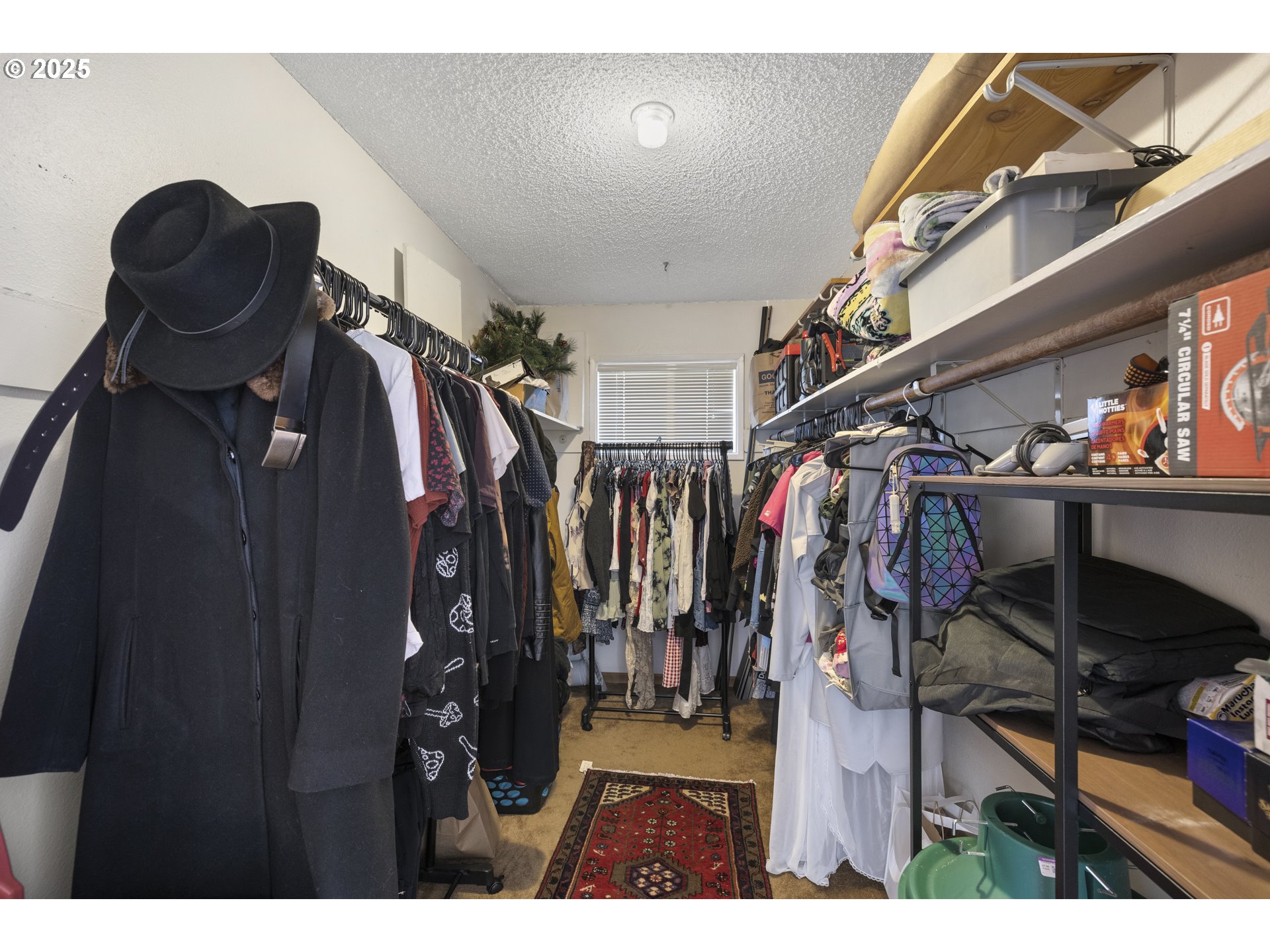 1418 Northeast Hogan Drive Gresham, OR 97030 - Photo 24 of 43 a view of walk in closet with clothes and shoes