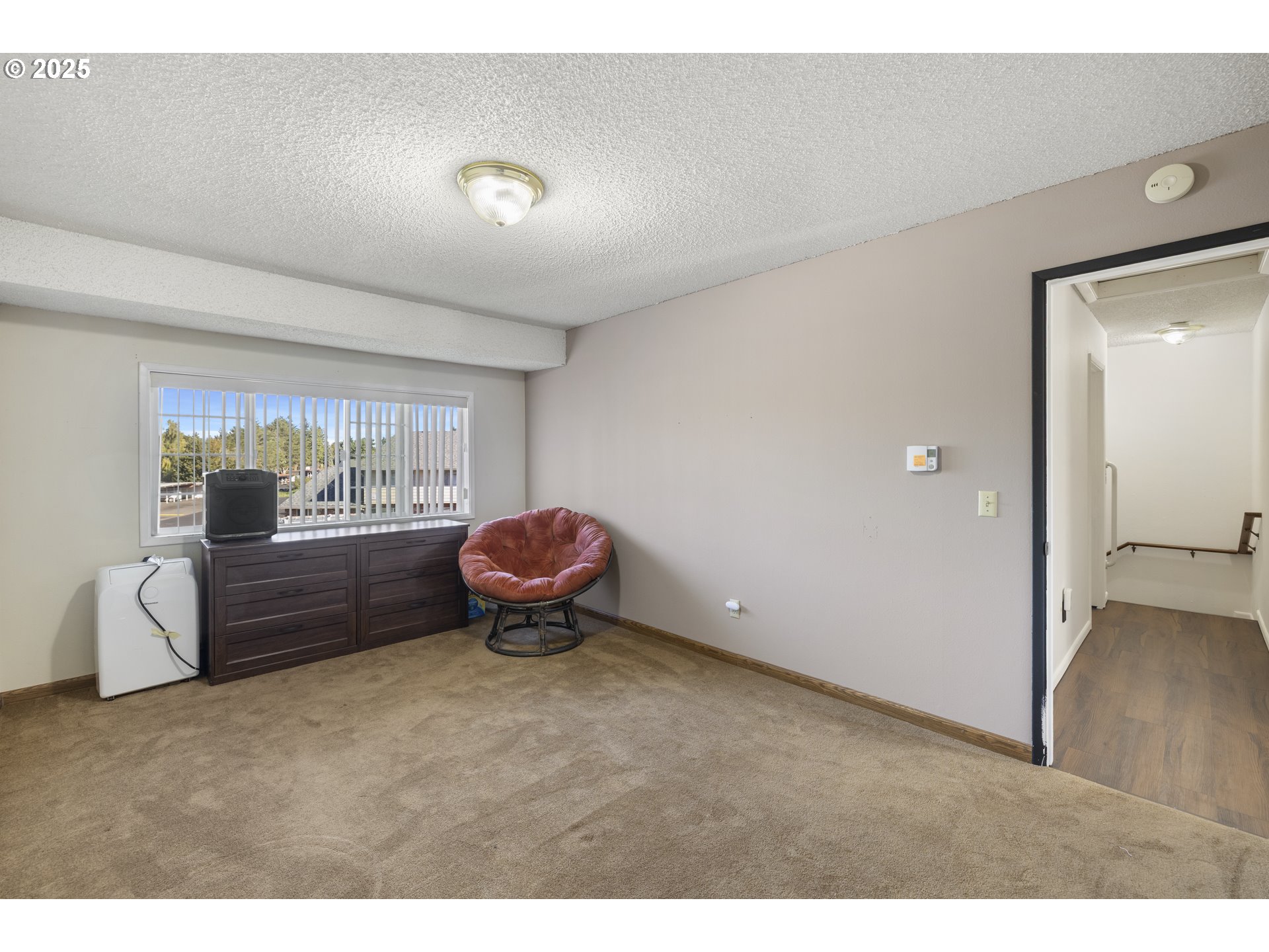 1418 Northeast Hogan Drive Gresham, OR 97030 - Photo 25 of 43 a living room with furniture and a large window