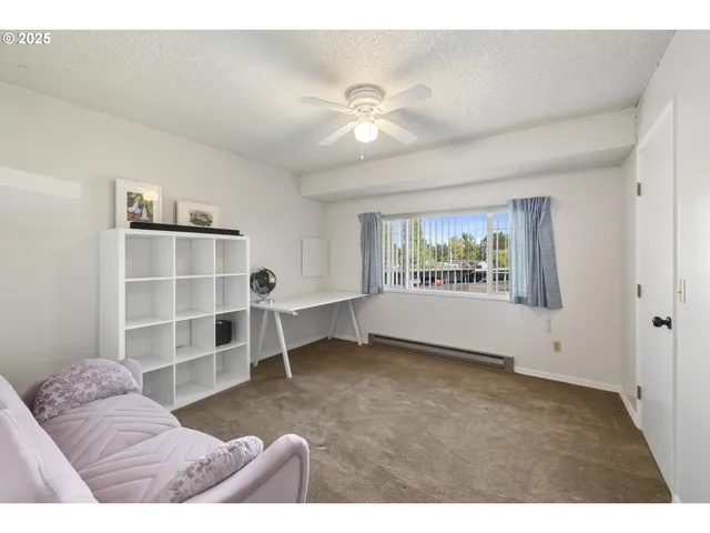 a bedroom with furniture and a window