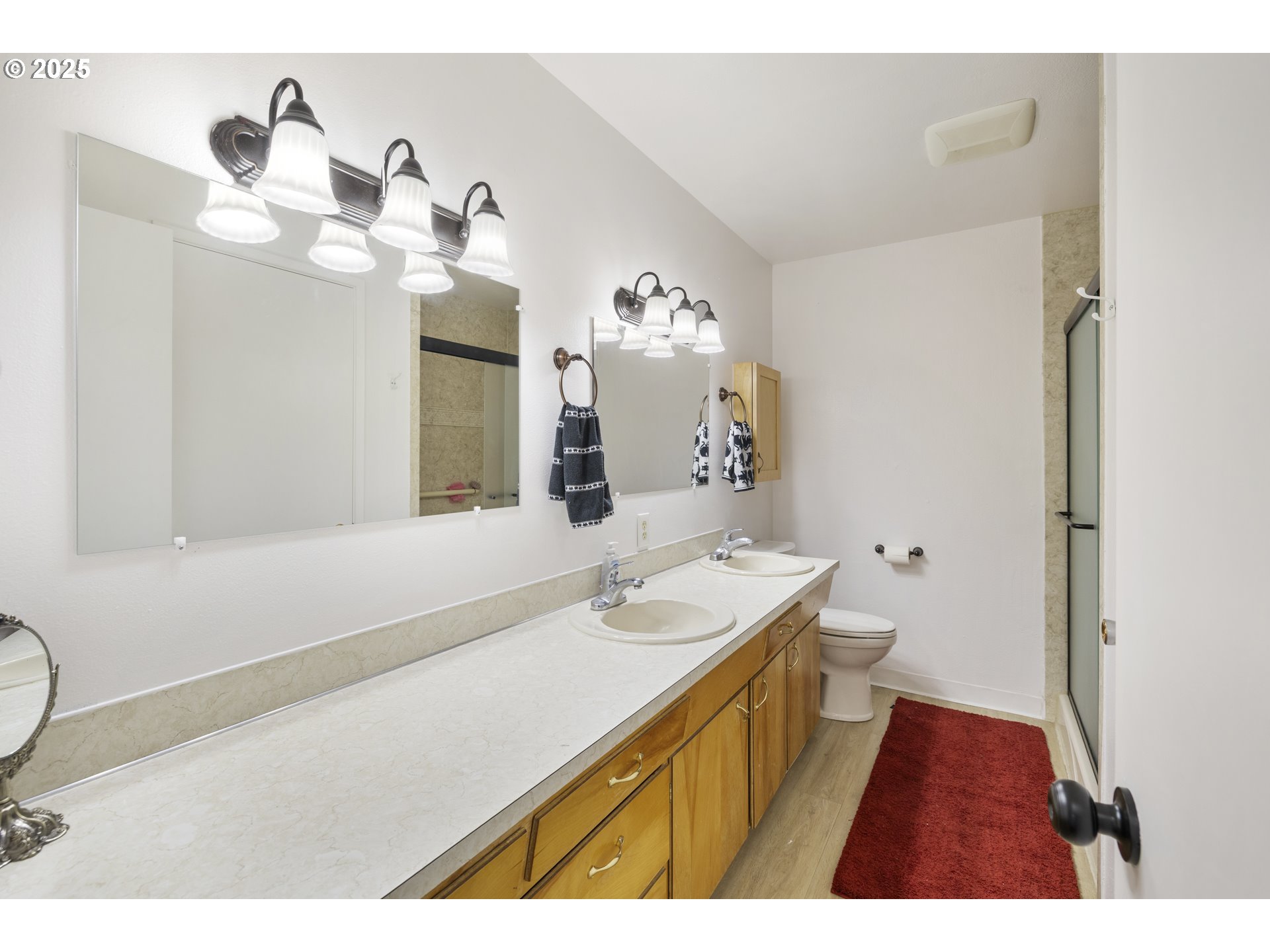 1418 Northeast Hogan Drive Gresham, OR 97030 - Photo 30 of 43 a bathroom with a sink a vanity and mirror