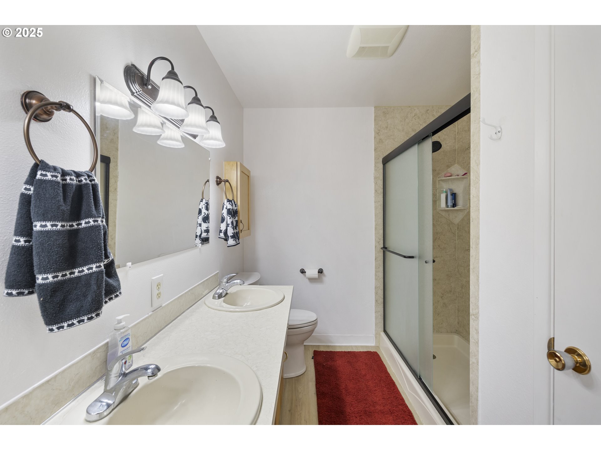 1418 Northeast Hogan Drive Gresham, OR 97030 - Photo 31 of 43 a bathroom with a sink and mirror