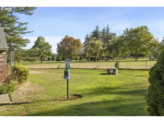 a view of a swimming pool with an outdoor space and seating area