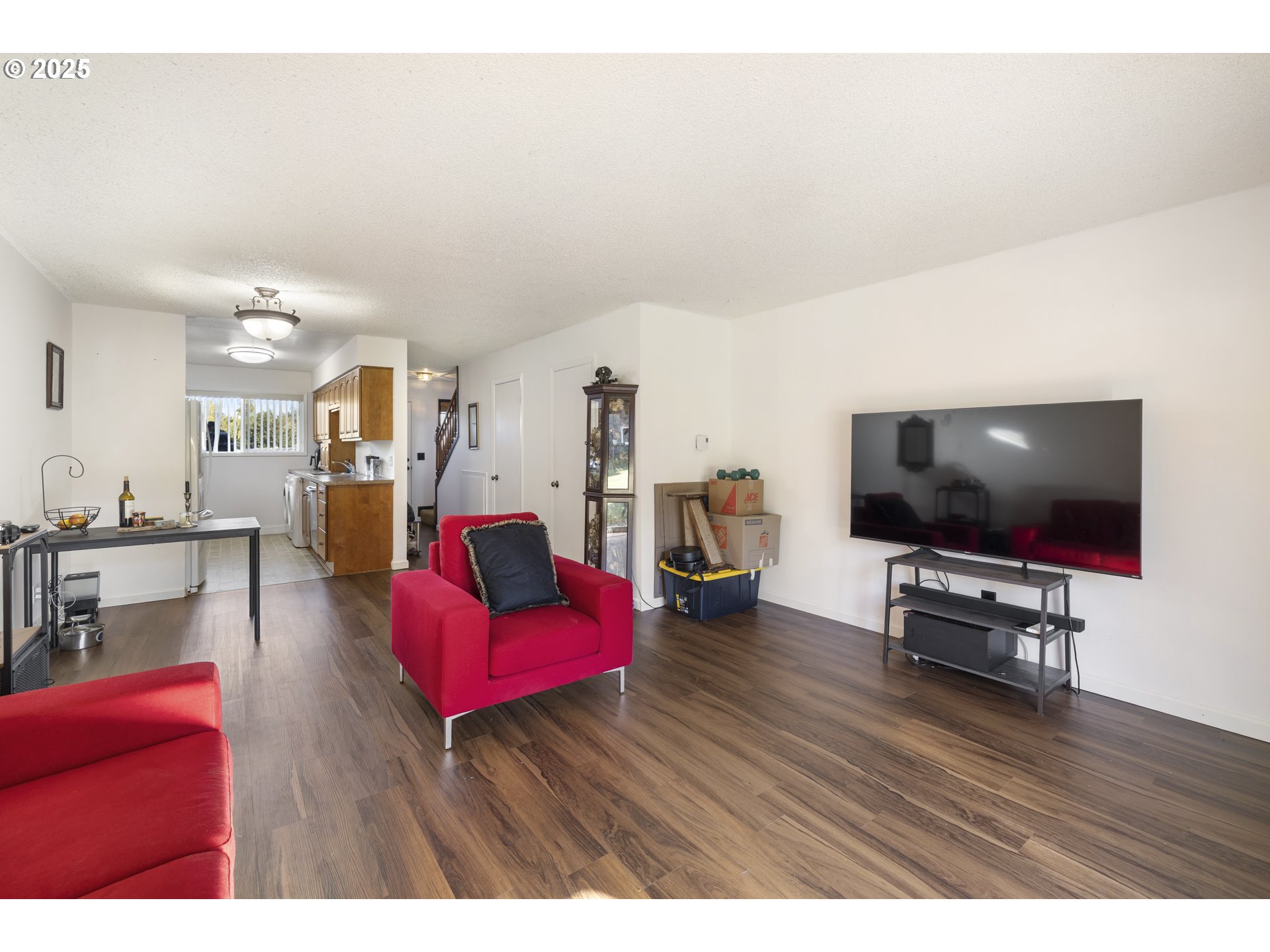 1418 Northeast Hogan Drive Gresham, OR 97030 - Photo 8 of 43 a living room with furniture and a flat screen tv