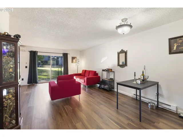 a living room with furniture fireplace and flat screen tv