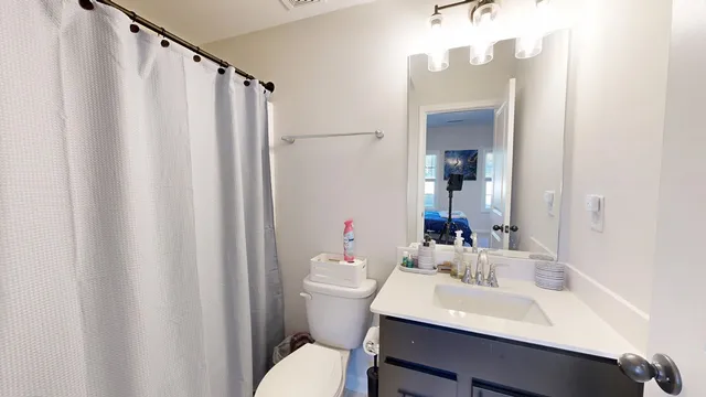 a living room with furniture flat screen tv and a fireplace