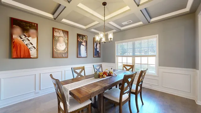 a living room with furniture or couch and a chandelier