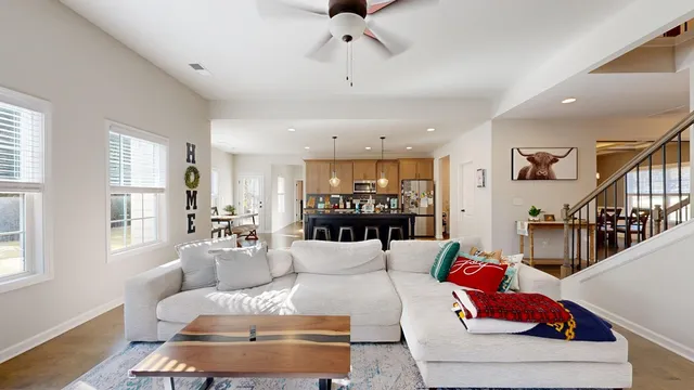 a living room with fireplace furniture and a flat screen tv