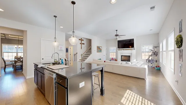 a living room with a flat screen tv and a couch