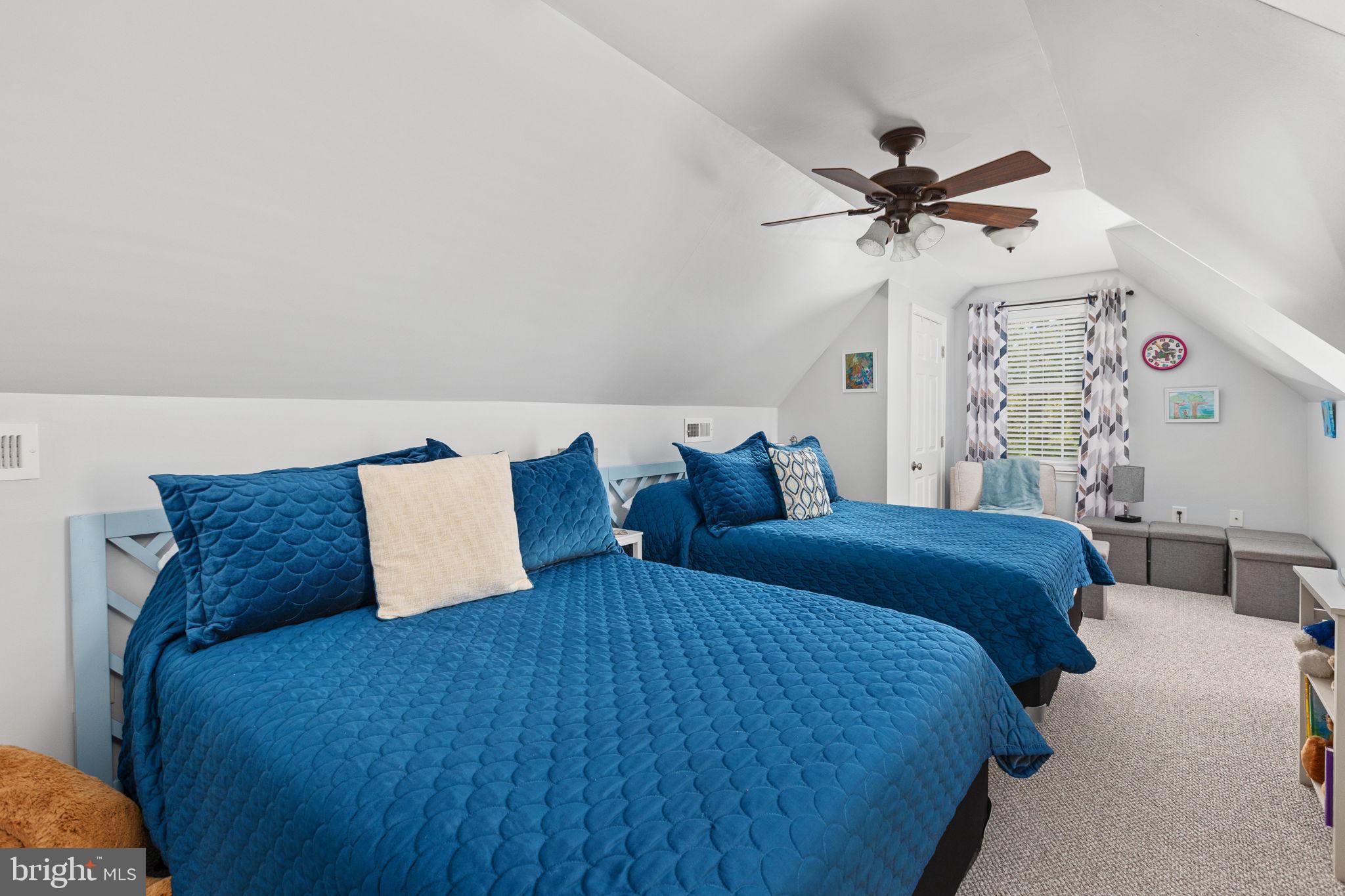 22088 Landora Bridge Road Ruther Glen, VA 22546 - Photo 69 of 122 Cozy attic retreat with vibrant hues.