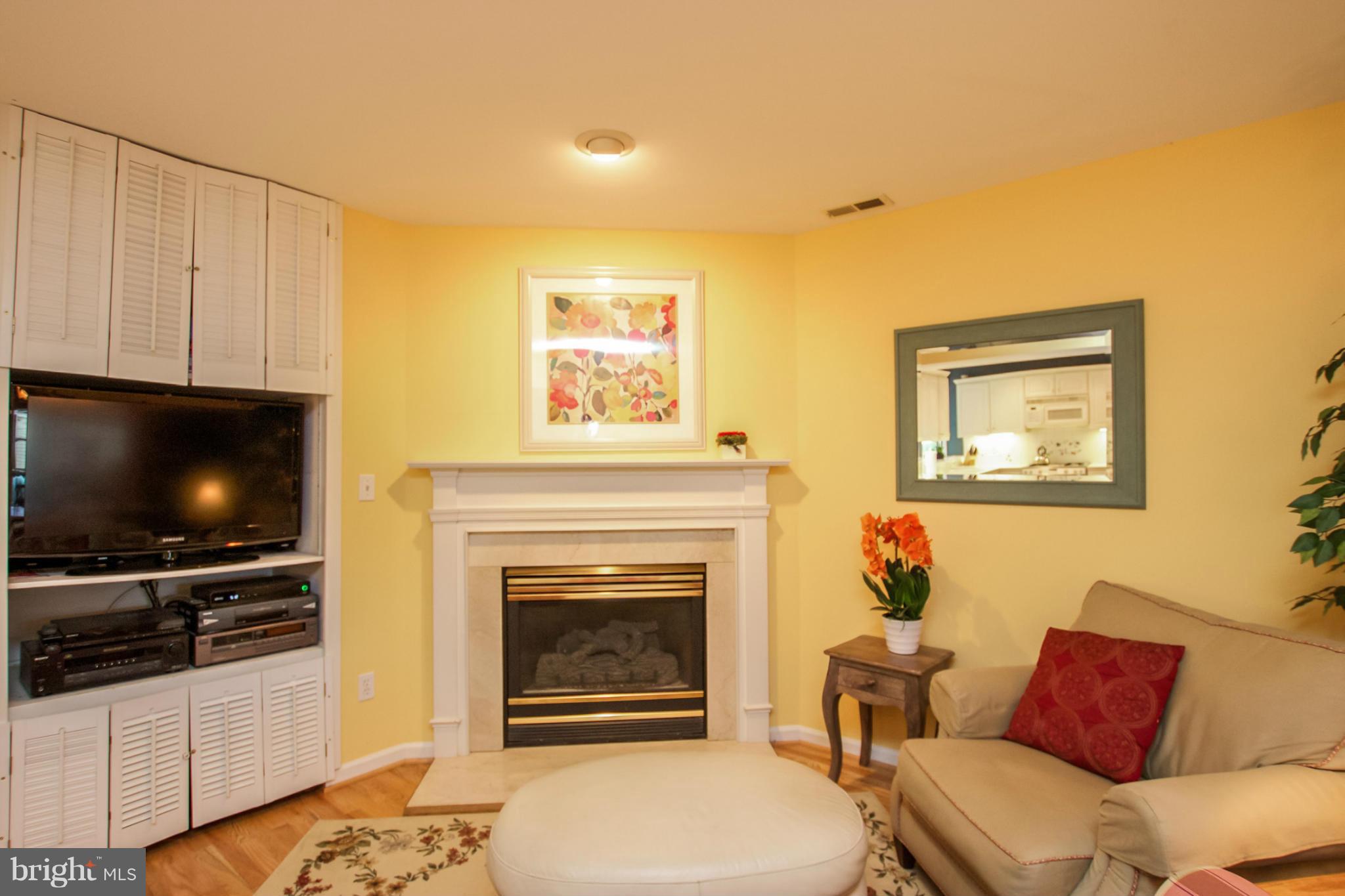 508 Yarmouth Road Baltimore, MD 21286 - Photo 5 of 28 a living room with furniture a flat screen tv and a fireplace