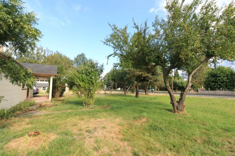 4782 Lower River Road Grants Pass, OR 97526 - Photo 21 of 28 a view of a house with a yard