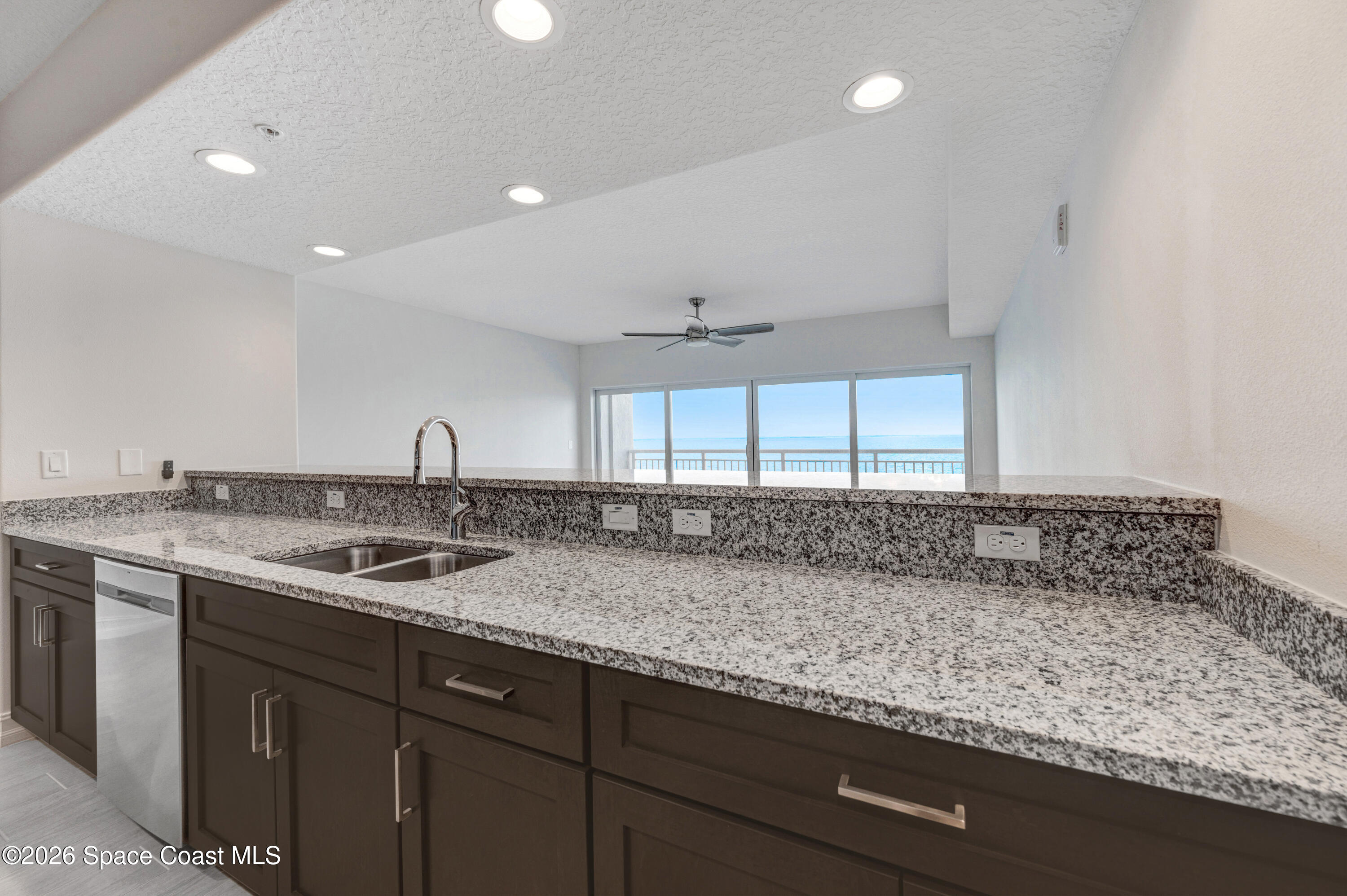 1805 Riverside Drive, Unit 304 Titusville, FL 32780 - Photo 24 of 46 a kitchen with a sink and a window
