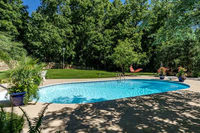 2716 Spring Creek Road Rockford, IL 61107 - Photo 66 of 76 a view of a backyard with swimming pool