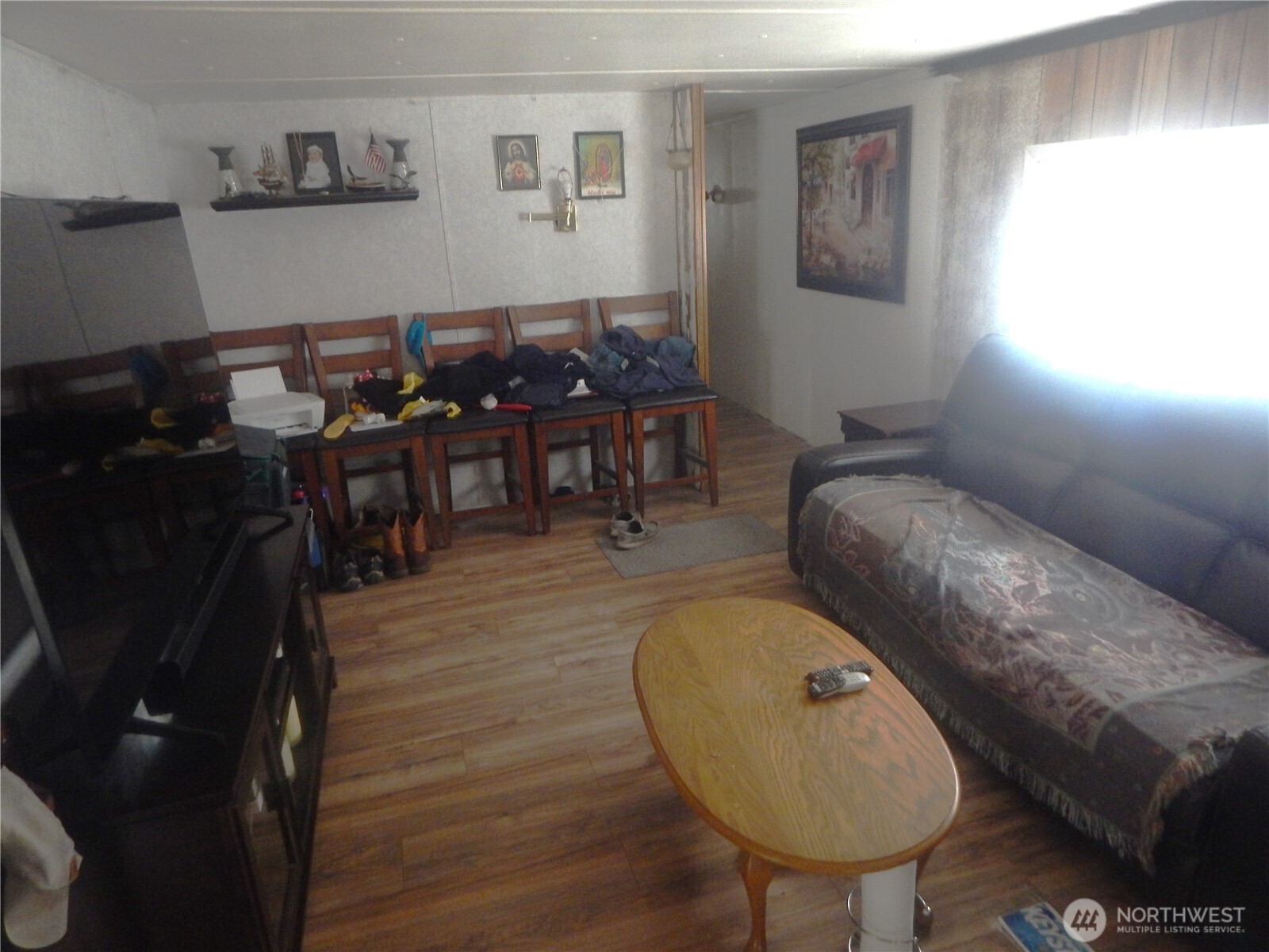 17930 Albany Street Southwest, Unit 57 Rochester, WA 98579 - Photo 2 of 12 a living room with furniture and a wooden floor