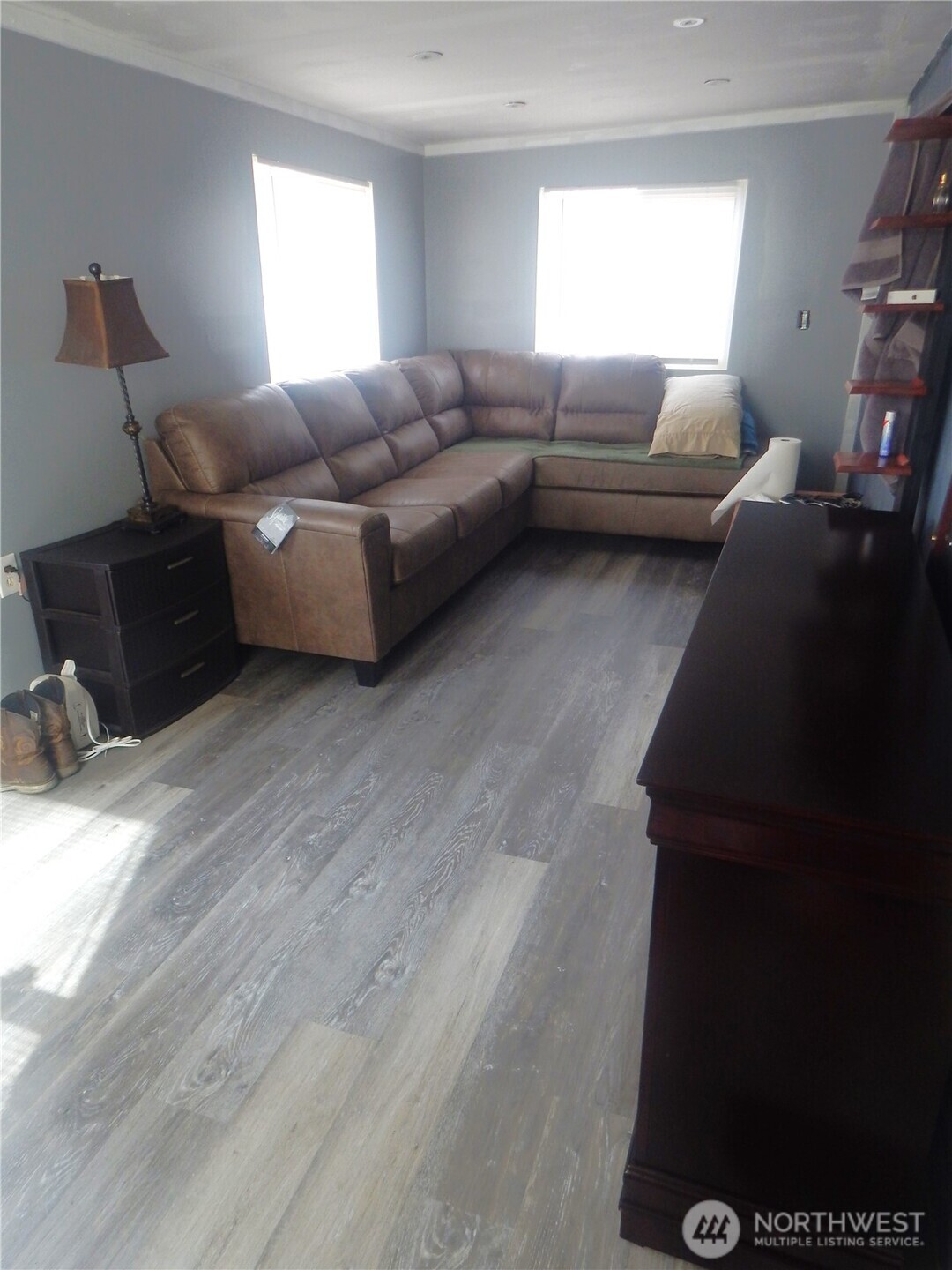17930 Albany Street Southwest, Unit 57 Rochester, WA 98579 - Photo 6 of 12 a living room with furniture and a window