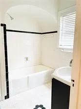 a view of a hallway with washer and dryer