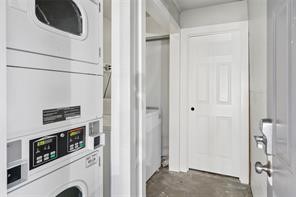 1849 West Main Street, Unit 15 Houston, TX 77098 - Photo 18 of 20 a view of a hallway with washer and dryer