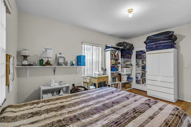 a bedroom with a bed and closet