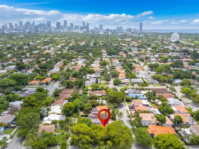 an aerial view of city and parking space