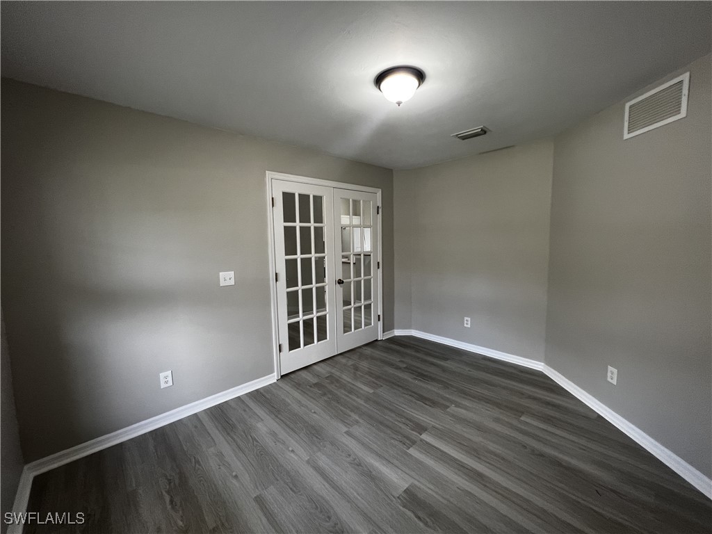 672 Homestead Road South Lehigh Acres, FL 33974 - Photo 9 of 35 a view of livingroom with window and hardwood floor