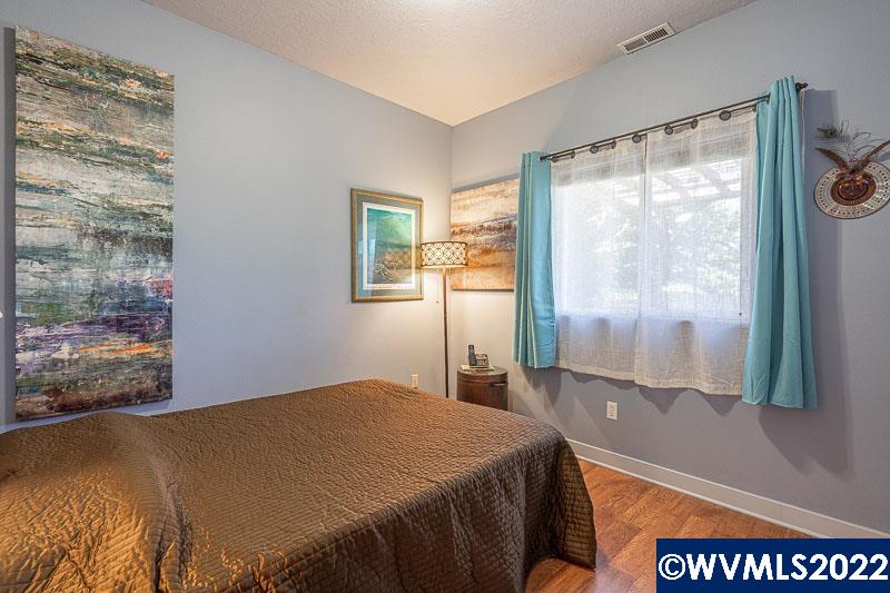 1569 Briar Road Independence, OR 97351 - Photo 14 of 24 a bedroom with a bed and a window