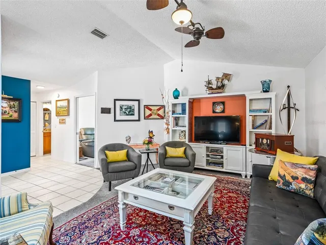 a dining room with furniture and a chandelier