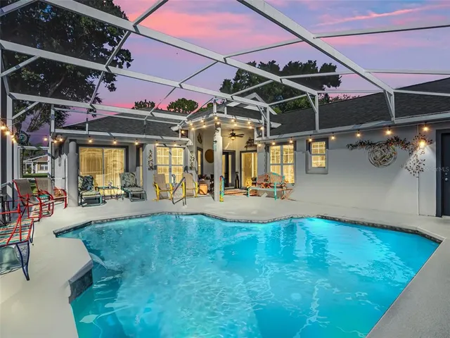 a view of a swimming pool with a patio