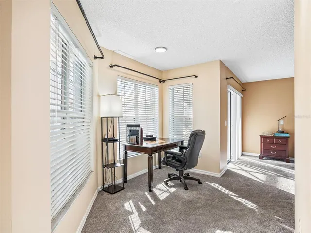 a bedroom with a bed and a television