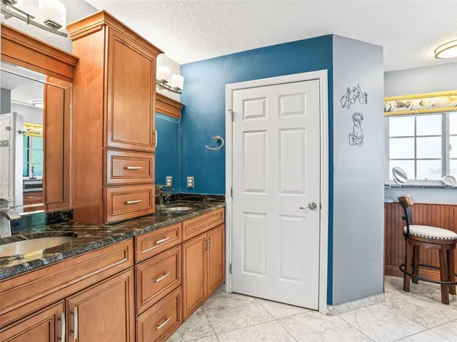 a bedroom with a bed and a book shelf