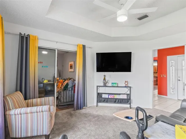 a view of a swimming pool with outdoor seating