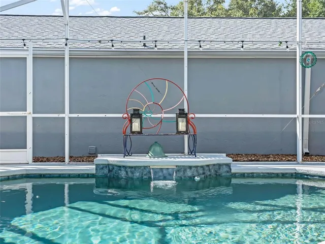 a view of a house with backyard and garden