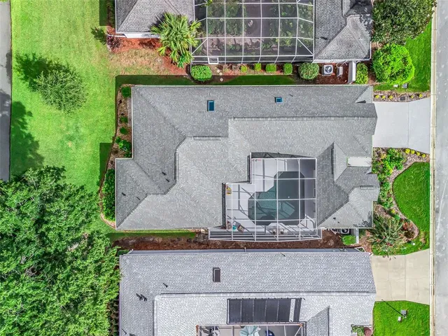 a view of a patio with table and chairs potted plants and wooden fence