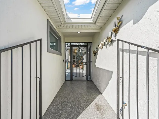 a living room with fireplace furniture and a large window