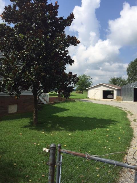 3894 Armstrong Road Springfield, TN 37172 - Photo 5 of 10 a view of a white house that has a tree in it