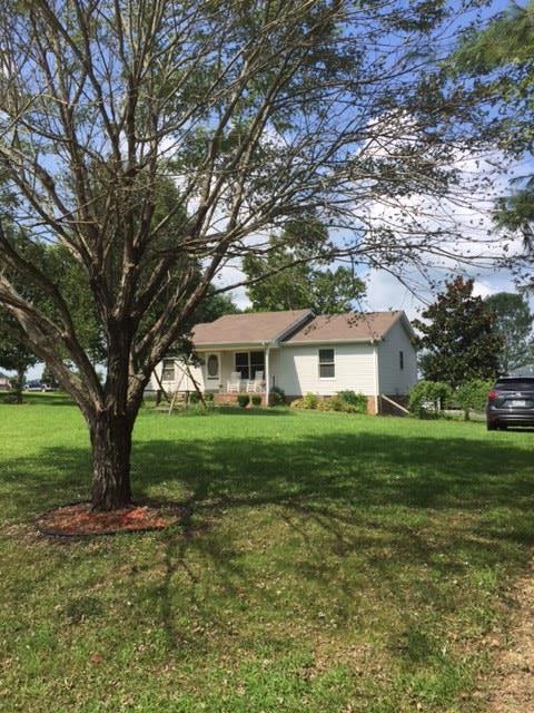 3894 Armstrong Road Springfield, TN 37172 - Photo 7 of 10 a view of a big yard next to a house with a large tree