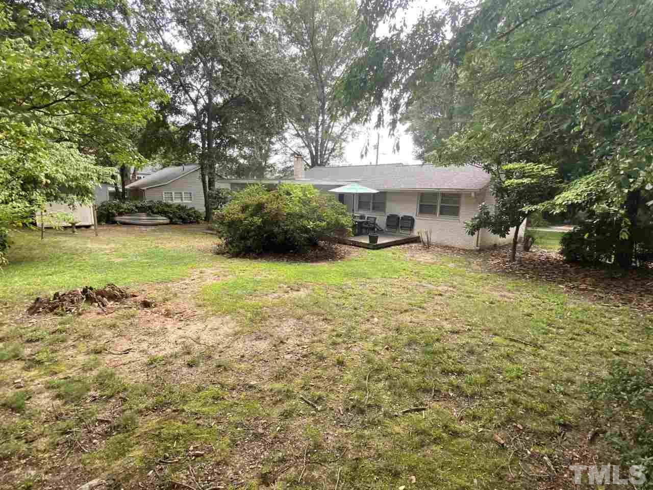 1412 Lyon Street Raleigh, NC 27608 - Photo 3 of 6 a view of a house with a yard and sitting area